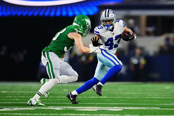 Malik Davis of the Dallas Cowboys carries the ball against the Philadelphia Eagles during the second half of an NFL football game at AT&T Stadium on...