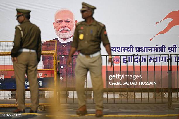 Police personnel stand guard near Ram Temple in Ayodhya on November 25 ahead of Indian Prime Minister Narendra Modi's visit.