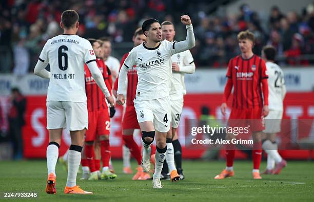 Kevin Diks of Borussia Monchengladbach celebrates scoring his team's first goal from the penalty spot during the Bundesliga match between 1. FC...