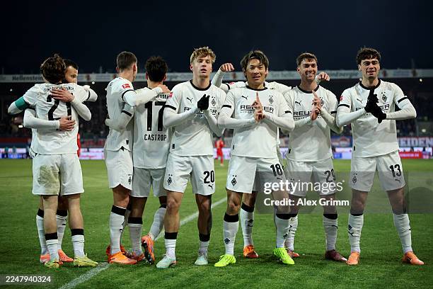 Shuto Machino of Borussia Monchengladbach celebrates scoring his team's third goal with teammates during the Bundesliga match between 1. FC...
