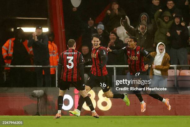 Enes Unal of AFC Bournemouth celebrates scoring his team's second goal with teammates Adrien Truffert and Amine Adli during the Premier League match...
