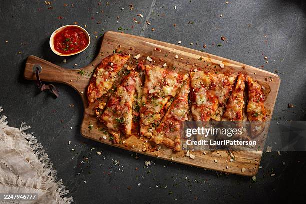 fire roasted double pepperoni pizza - rectangle pizza stock pictures, royalty-free photos & images