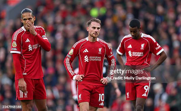 Virgil van Dijk, Alexis Mac Allister and Alexander Isak of Liverpool look dejected following the Premier League match between Liverpool and...