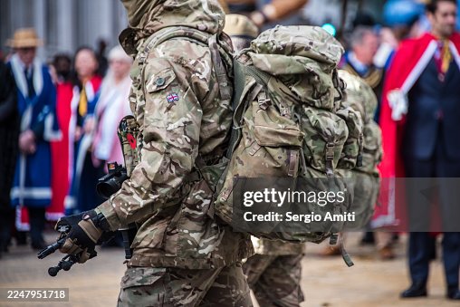 Soldier In Camouflage With Large Bergen And Gloves At Lord Mayor’s Show In City Of London Soldier In Camouflage With Large Bergen And Gloves At Lord Mayor’s Show In City Of London