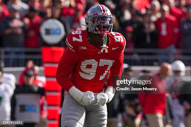 Defensive end Kenyatta Jackson Jr. #97 of the Ohio State Buckeyes reacts to a stoppage during the first quarter against the Rutgers Scarlet Knights...
