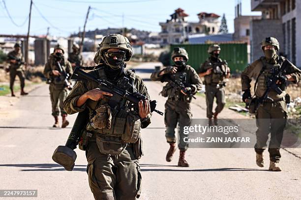 Israeli soldiers patrol the streets of Tubas in the occupied West Bank during a military operation on November 26, 2025. Israel's military launched a...