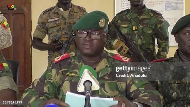 Screen grab shows the Head of the Presidential Military Office of Guinea-Bissau, Denis N'Canha , announcing with a group of officers that full...