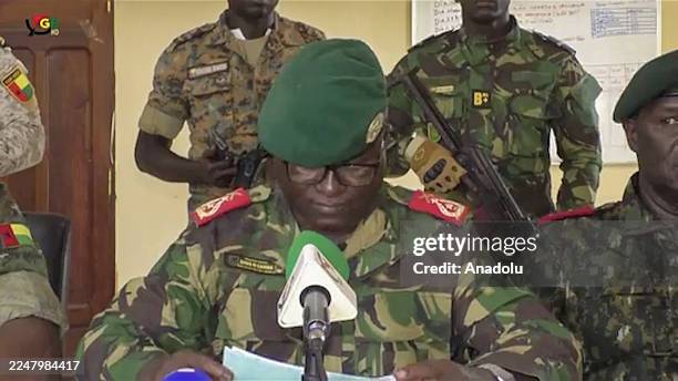 Screen grab shows the Head of the Presidential Military Office of Guinea-Bissau, Denis N'Canha , announcing with a group of officers that full...