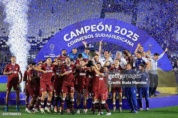 Carlos Izquierdoz and Lautaro Acosta of Lanus prepare to lift the Champion's trophy after winning the the 2025 Copa CONMEBOL Sudamericana final...