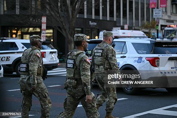 National Guard soldiers gather near a crime scene after a shooting in downtown Washington, DC, on November 26, 2025. Two members of the National...
