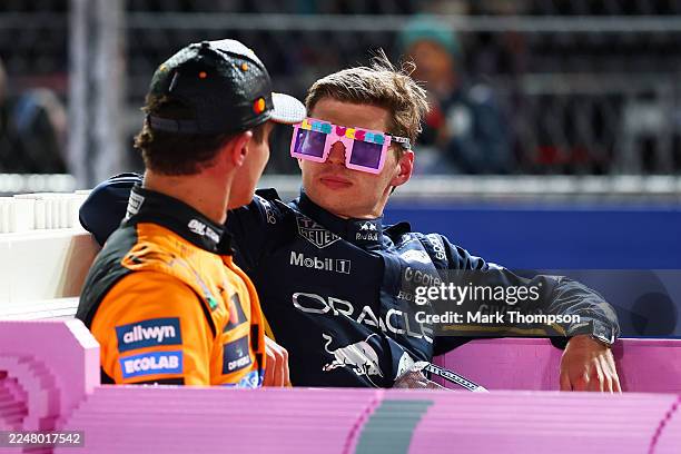 Race winner Max Verstappen of the Netherlands and Oracle Red Bull Racing and Second placed Lando Norris of Great Britain and McLaren in a Lego pink...