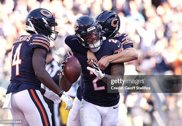 Moore and Caleb Williams of the Chicago Bears celebrate a first quarter touchdown against the Pittsburgh Steelers at Soldier Field on November 23,...