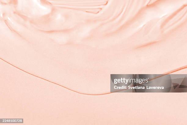close-up of smooth pink texture with glossy surface highlights and delicate bubbles - im scheinwerferlicht gefangen stock-fotos und bilder