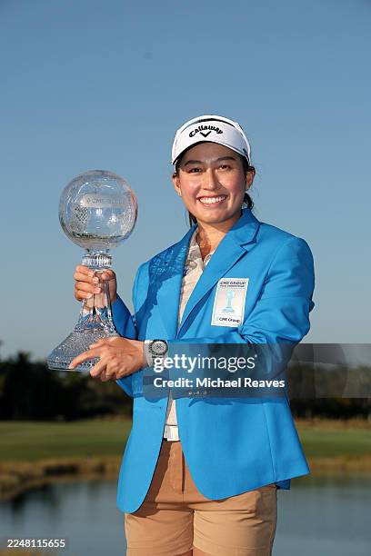 Jeeno Thitikul of Thailand poses with the CME Group trophy and jacket after her win during the final round of the CME Group Tour Championship 2025 at...