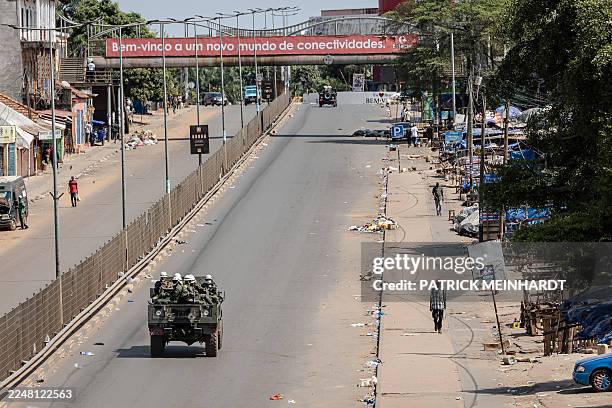 Bissau Military Police patrol car drives along a deserted avenue in Bissau, on November 27, 2025. The Guinea-Bissau military appointed a general as...
