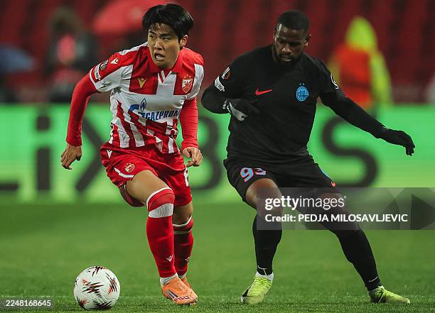 Crvena Zvezda Beograd's South Korean defender Young-Woo Seol fights for the ball with Steaua Bucharest's Senegalese forward Mamadou Thiam during the...