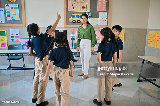 elementary teacher engaging students in a classroom activity - role play stock pictures, royalty-free photos & images