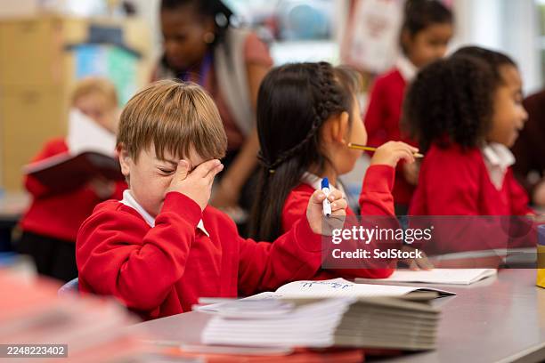 frustration doing school work - rubbing eyes stock pictures, royalty-free photos & images