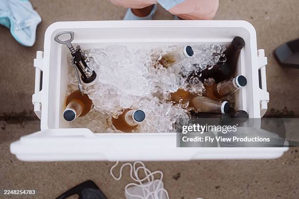 cooler filled with ice and chilled drinks - esky drinks stock pictures, royalty-free photos & images