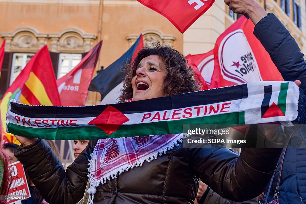 Protestet A protester displays a scarf in support of Palestine during the USB ...