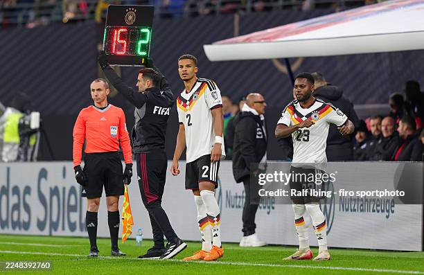 Malick Thiaw of Germany and teammate Ridle Baku before coming on as substitutes during the FIFA World Cup 2026 qualifier match between Germany and...
