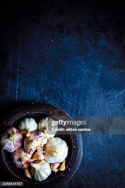 garlic seasoning in dark stock - garlic stock pictures, royalty-free photos & images