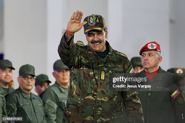 President of Venezuela Nicolás Maduro greets his supporters during a military ceremony commemorating the 200th anniversary of the presentation of the...