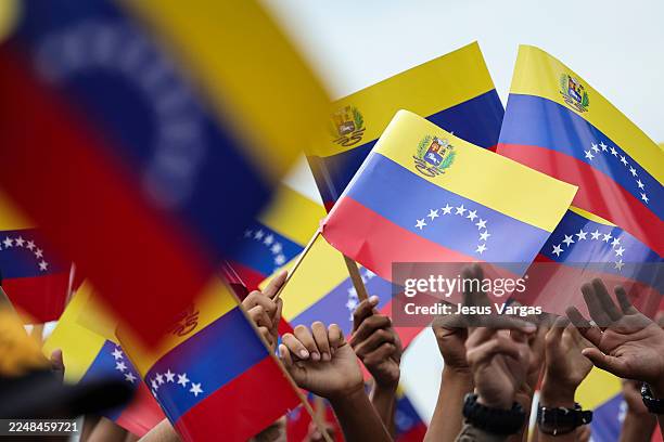 Supporters of President of Venezuela Nicolás Maduro wave flags during a civic-military rally on November 25 in Caracas, Venezuela. The United States...