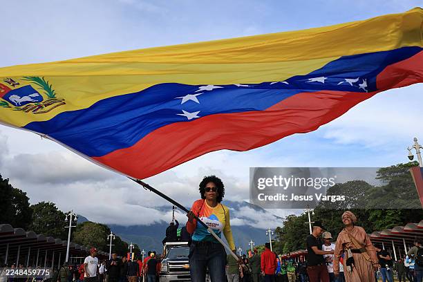 Supporter of president of Venezuela Nicolás Maduro waves a flag during a civic-military rally on November 25 in Caracas, Venezuela. The United States...