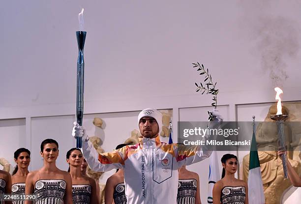 Torchbearer Petros Gaidatzis carries the Olympic Flame during the lighting ceremony of the Olympic Flame for the Milano Cortina 2026 Olympic Winter...
