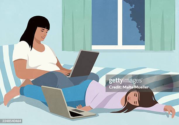 woman working at laptop next to tired daughter sleeping at laptop on bed - family movie night stock illustrations