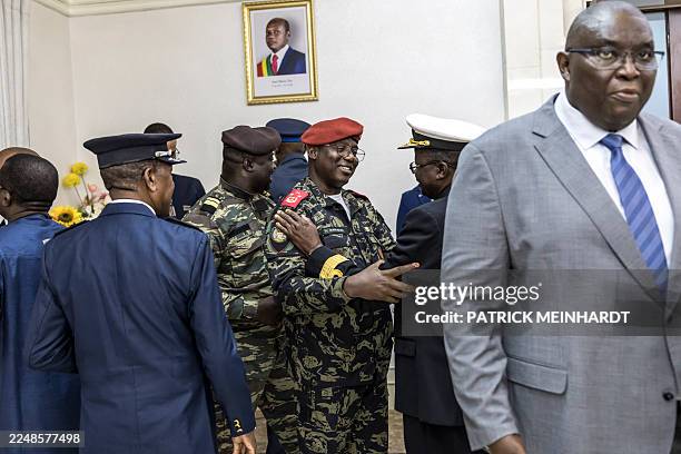 Deputy Chief of Staff of the Army Orland P. Nam Cobna congratulates newly appointed Minister of Health, Commodore Quinhin Nantote , during the...