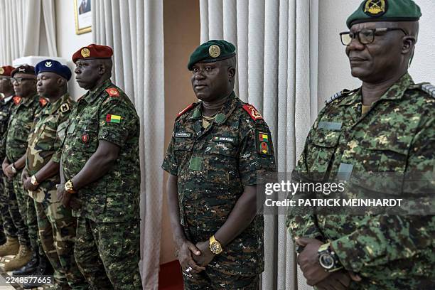 Brigadier General Denis N'Canha stands next to high ranking officers from different branches of the Guinea Bissau army during the swearing-in...