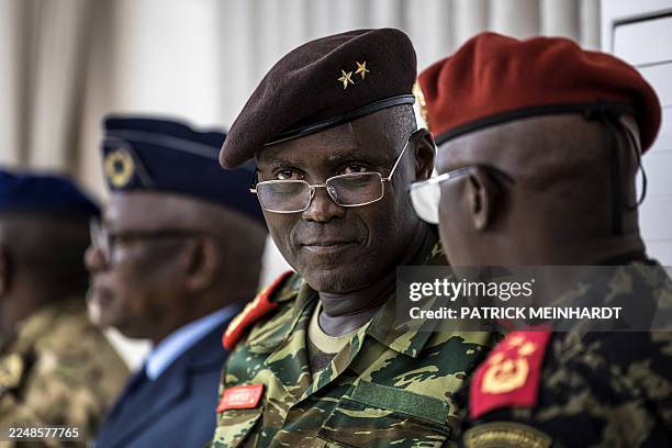 Ad hoc Secretary of the military command Samuel Fernandes speaks with Deputy Chief of Staff of the Army Orland P. Nam Cobna during the swearing-in...