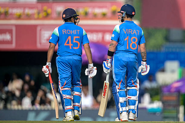 India's Virat Kohli and Rohit Sharma gesture during the first one-day international cricket match between India and South Africa at the JSCA...