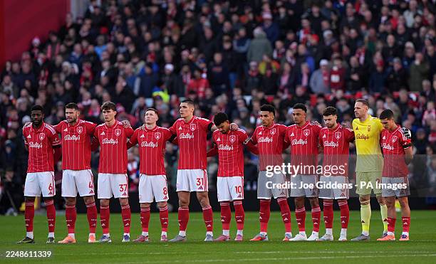 Nottingham Forest players stand for a minute's silence in memory of former Nottingham Forest academy player Joshua Travis before Premier League match...