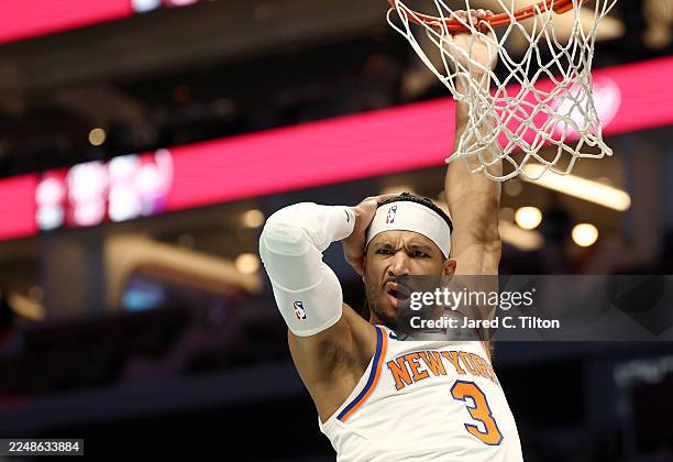 Josh Hart of the New York Knicks reacts following a dunk during the first quarter of the game against the Charlotte Hornets at Spectrum Center on...