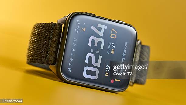 Detail of a Garmin Venu X1 premium GPS smart watch, with Moss ComfortFit nylon band.