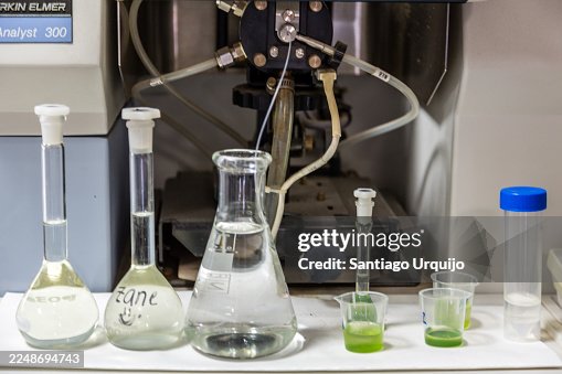 Flasks with algae samples to be analyzed with a spectrometer Flasks with algae samples to be analyzed with a spectrometer
