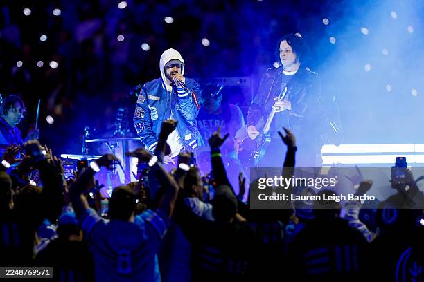 Eminem and Jack White perform during half time of the NFL 2025 game between Green Bay Packers and Detroit Lions at Ford Field on November 27, 2025 in...