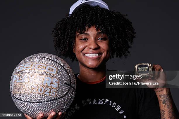 Rori Harmon of the Texas Longhorns poses for a portrait after winning the MGM MVP Ring and the Players Era Championship basketball tournament at...