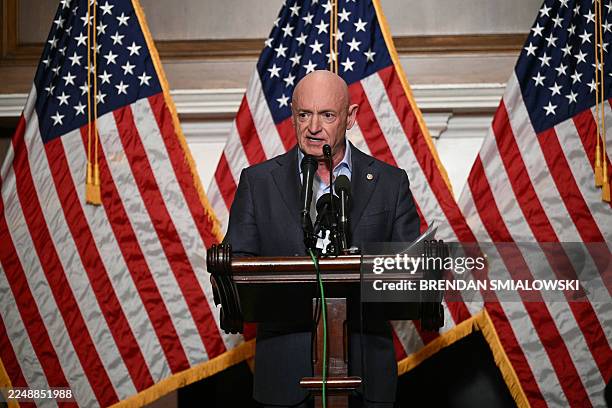 Senator Mark Kelly, Democrat from Arizona, speaks during a press conference at the US Capitol on December 1, 2025 in Washington, DC.