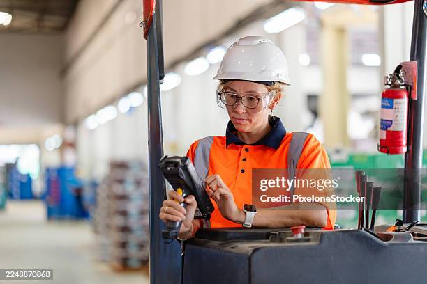 warehouse worker using barcode reader in warehouse. - shelf stocker stock pictures, royalty-free photos & images