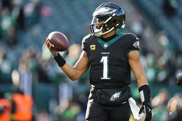 Jalen Hurts of the Philadelphia Eagles warms up prior to the game against the Chicago Bears at Lincoln Financial Field on November 28, 2025 in...