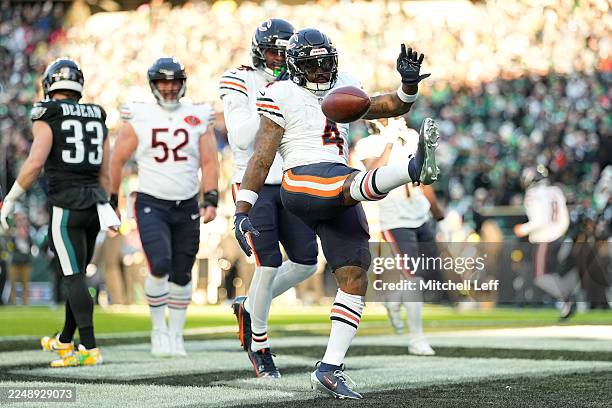 Andre Swift of the Chicago Bears celebrates after scoring a yard touchdown against the Philadelphia Eagles during the first quarter in the game at...