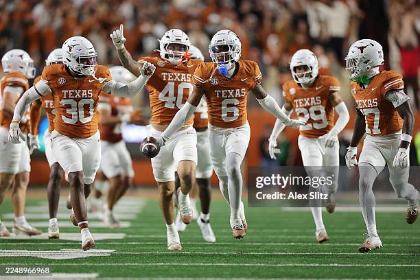 Kobe Black of the Texas Longhorns celerbates a interception during the fourth quarter of a game against the Texas A&M Aggies at Darrell K Royal-Texas...