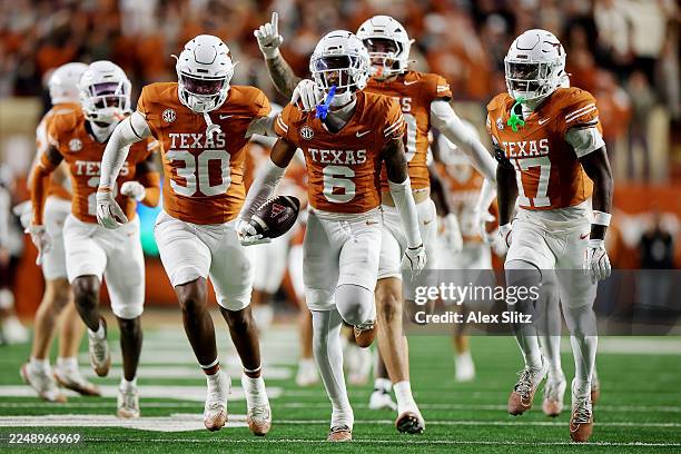 Kobe Black of the Texas Longhorns celerbates a interception during the fourth quarter of a game against the Texas A&M Aggies at Darrell K Royal-Texas...