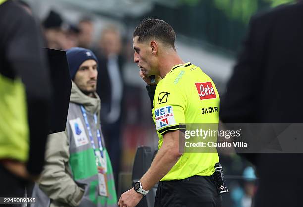 Referee goes to take a look at the VAR -screen during the Serie A match between AC Milan and SS Lazio at Giuseppe Meazza Stadium on November 29, 2025...
