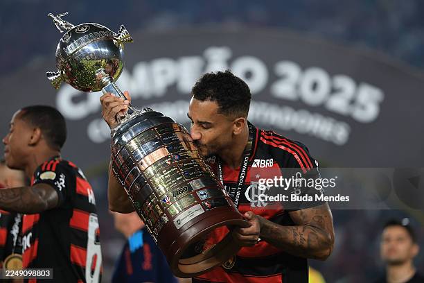 Danilo of Flamengo celebrates with the trophy after winning the 2025 Copa CONMEBOL Libertadores Final match between Palmeiras and Flamengo at Estadio...
