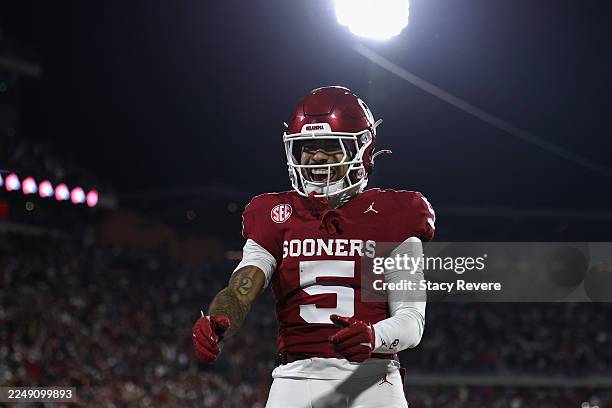 Isaiah Sategna III of the Oklahoma Sooners celebrates after scoring a touchdown against the Louisiana State Tigers during the fourth quarter at...